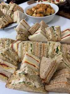 Assorted sandwiches on a platter for afternoon tea catering in Surrey.